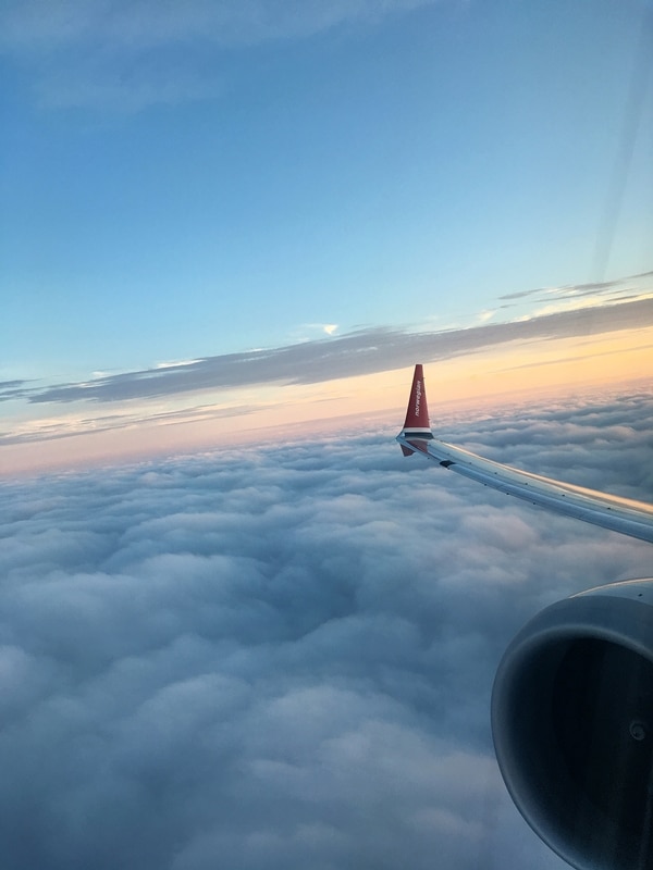 view of the sky at dusk from an airplane