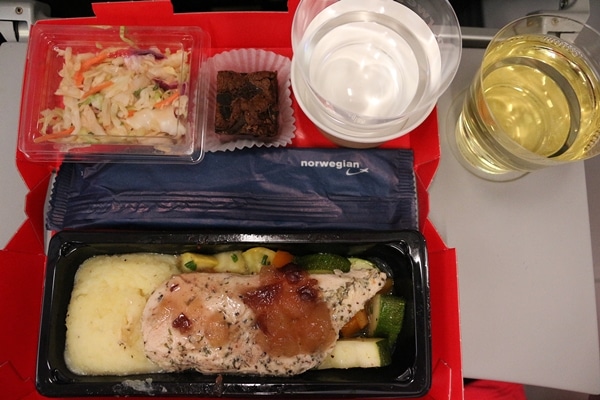 A close up of a tray of airplane food