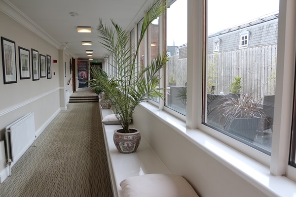 a hallway lined with windows