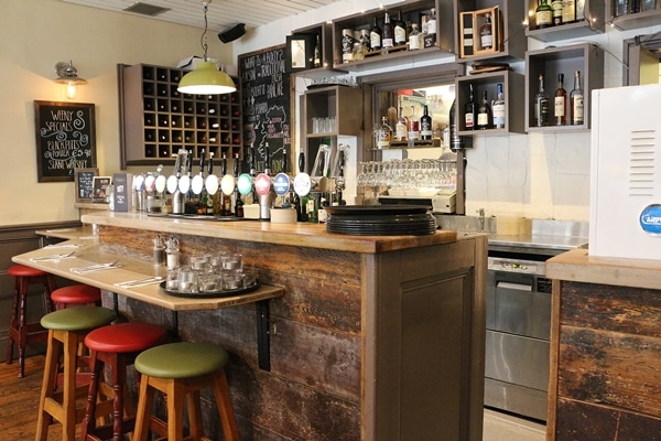 the bar area inside a restaurant