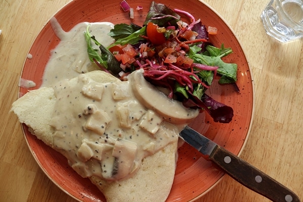 a potato pancake with a mushroom sauce over the top