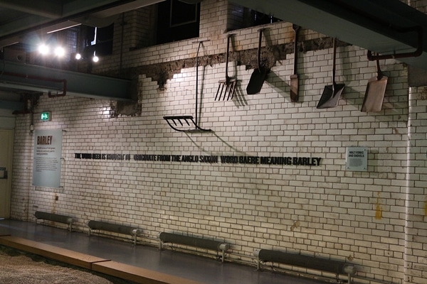 a wall covered in white subway tiles