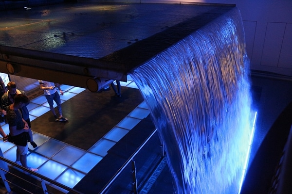 a waterfall lit with blue lights