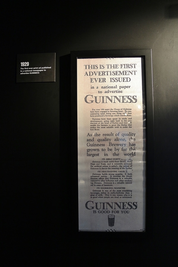 A close up of a sign about Guinness advertising