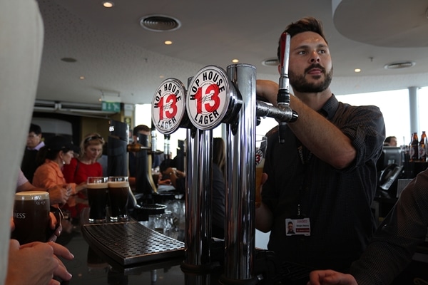 a bartender pouring beers