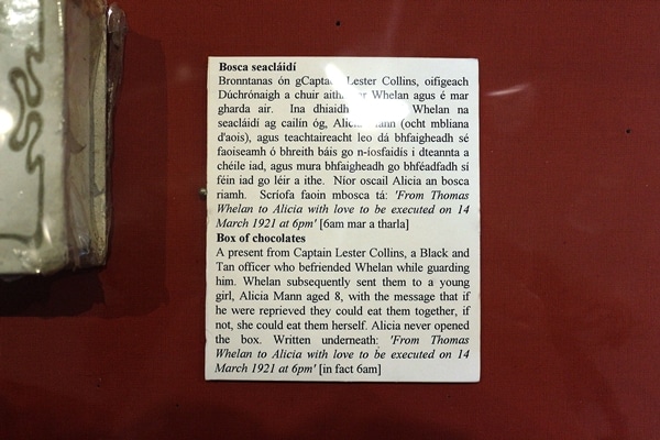 a museum sign discussing a box of chocolates on display