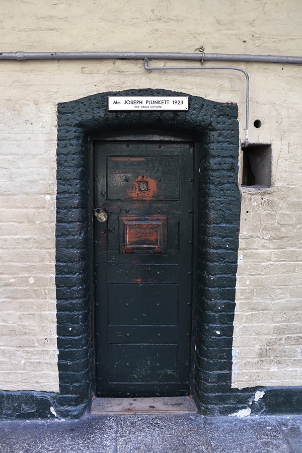 a door to an old prison cell