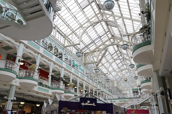 a large glass covered shopping center