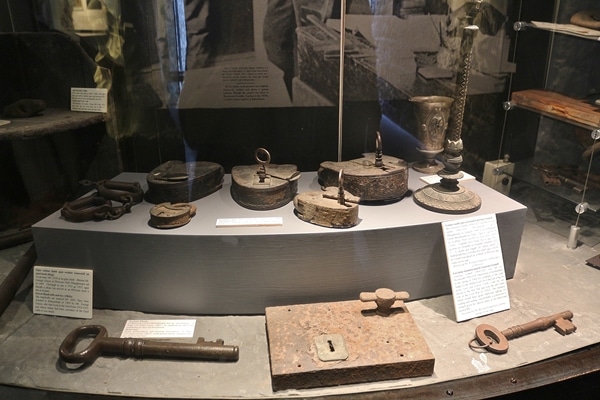 a museum display of old prison locks and keys