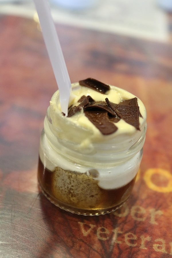 A close up of a chocolate dessert in a jar