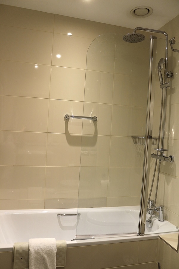 A shower in a hotel bathroom