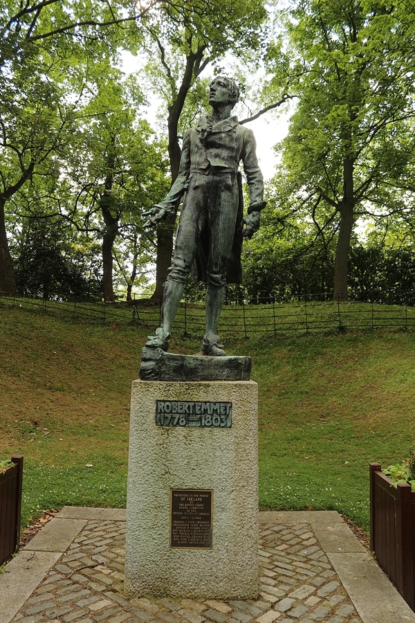 a statue of a man in a park