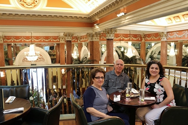 A group of people sitting at a table in a restaurant