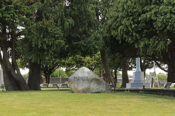 a large rock in the middle of a field