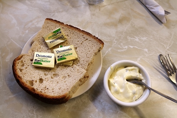 bread and tartar sauce on a table