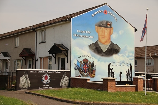 wide view of a mural of a solider on a building