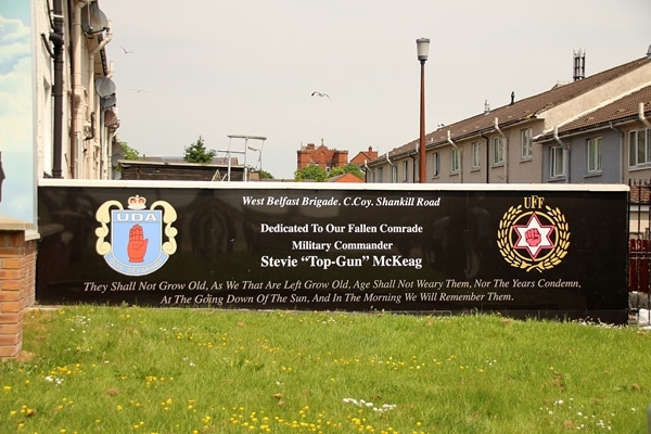 A sign dedicating a mural to Stevie \"Top-Gun\" McKeag