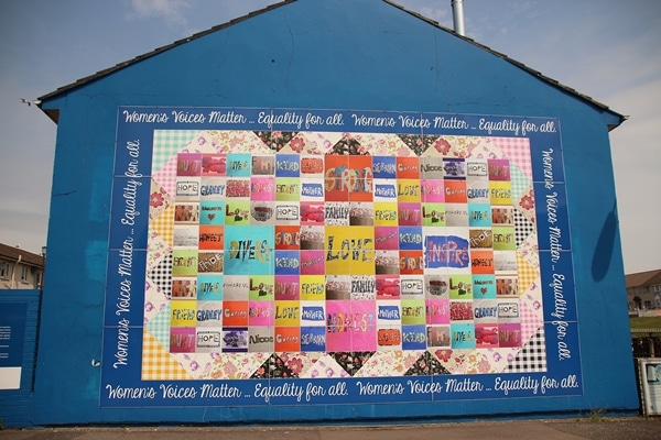 a colorful mural that says Women\'s Voices Matter... Equality for All