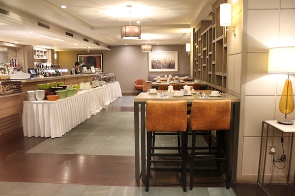 a dining area with a breakfast buffet setup