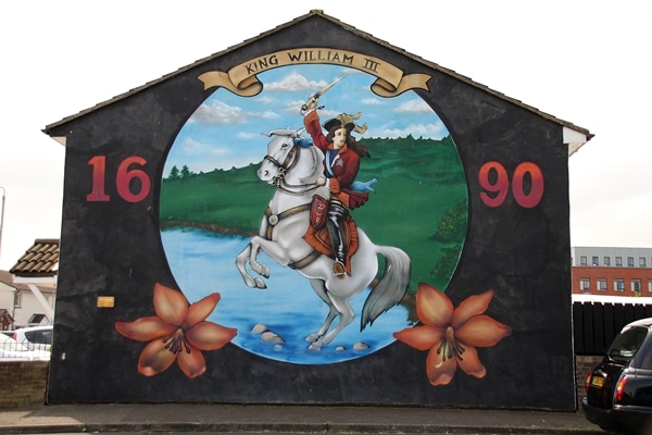 a mural of King William III painted on a building