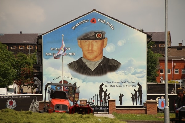 a mural of a soldier on the side of a building