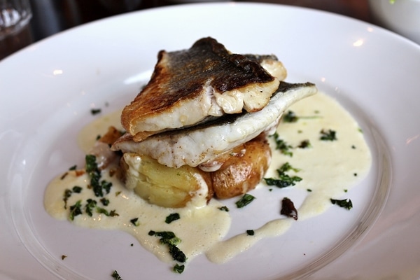 fillets of fish served over roasted potatoes