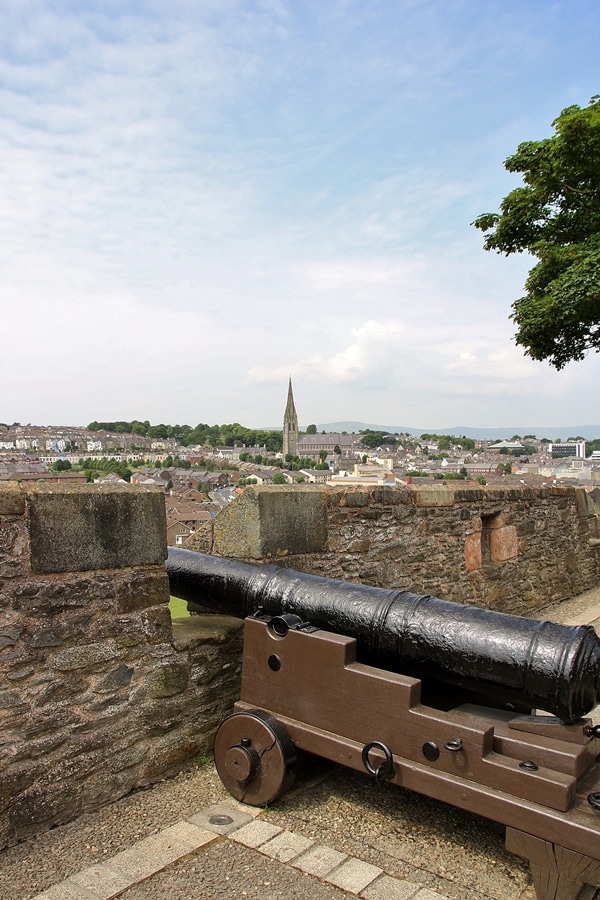 a cannon displayed overlooking a city