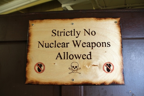 A sign that says Strictly No Nuclear Weapons Allowed