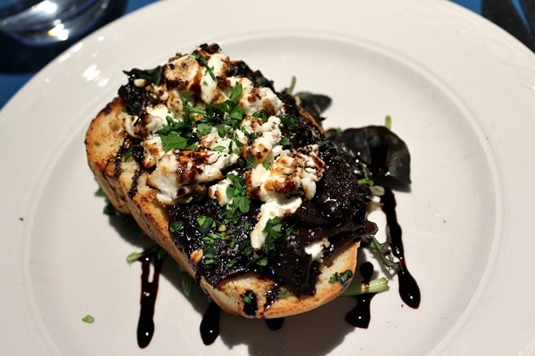 toasted bread with goat cheese on top