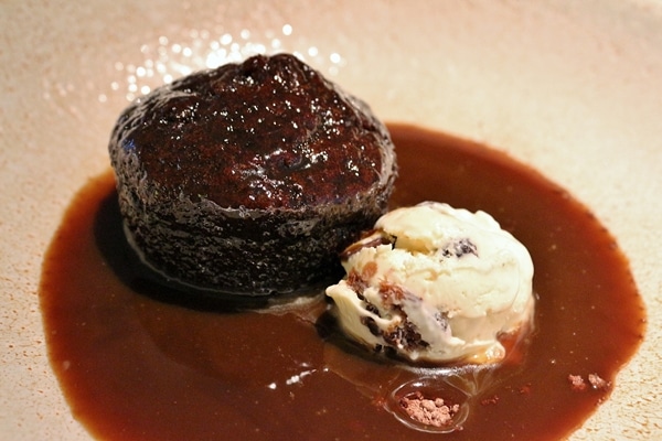 sticky toffee pudding with ice cream on a plate