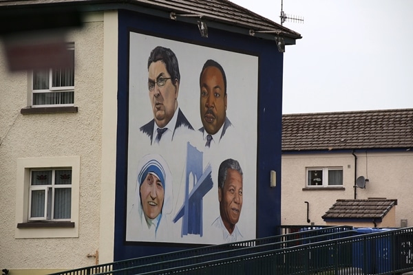 portraits painted on the side of a building