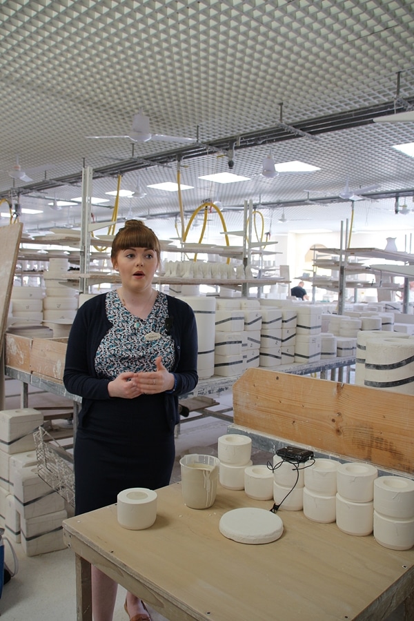 a woman in a pottery factory