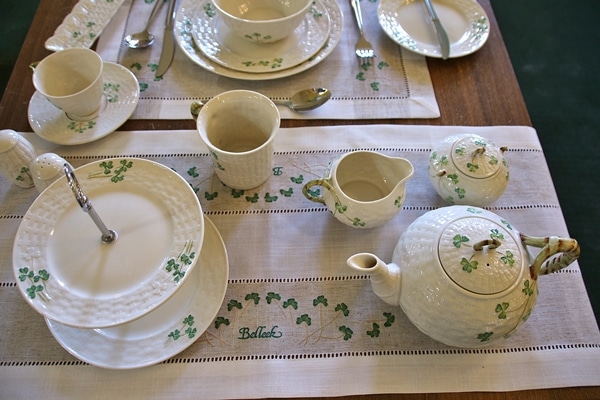 a variety of pottery items decorated with shamrocks