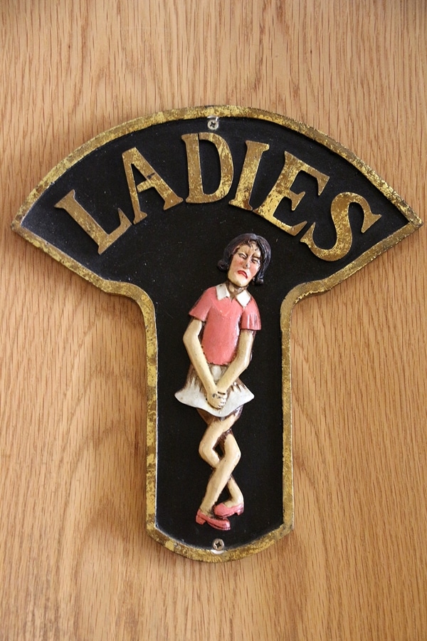 a door sign for the Ladies bathroom