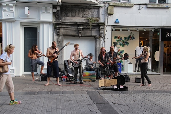 A group of people performing music on a street