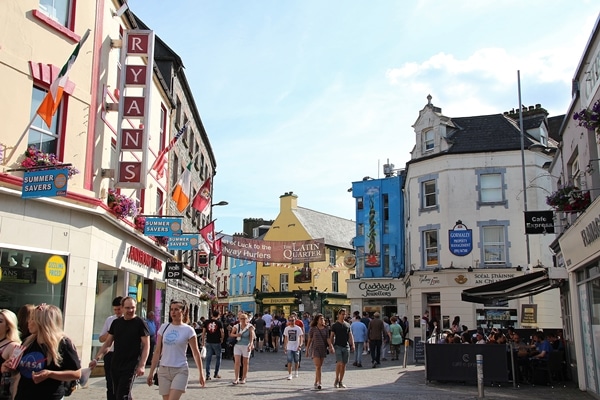 A group of people walking on a city street