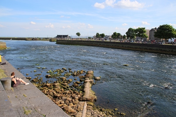 the rocky shore of a small body of water