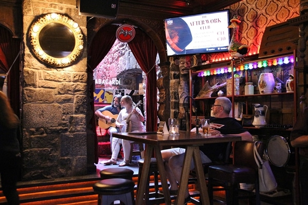 musical performers inside an Irish pub