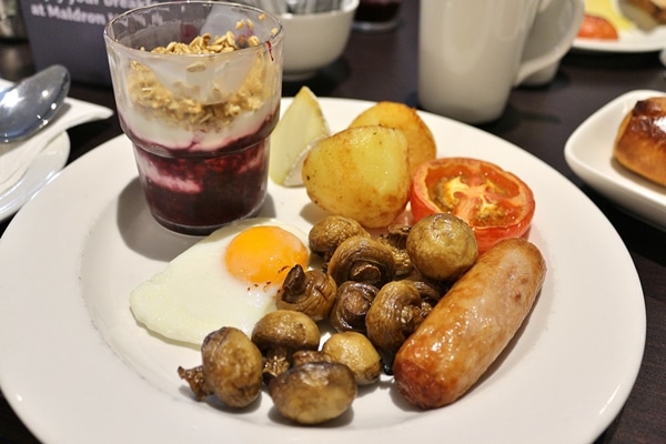 an Irish style breakfast on a white plate