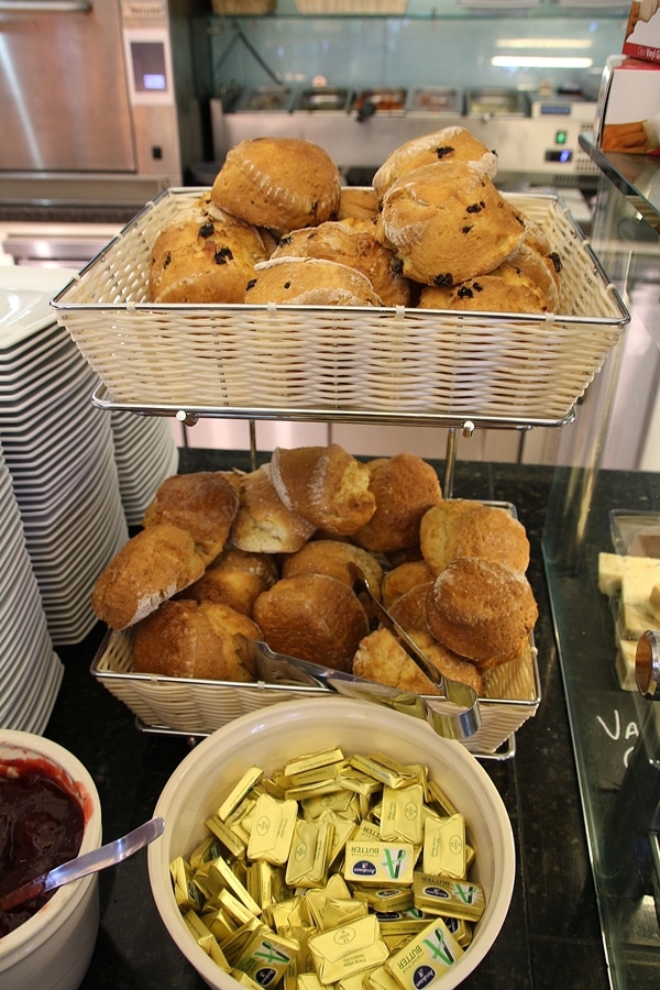 a display of muffins and scones in a cafe