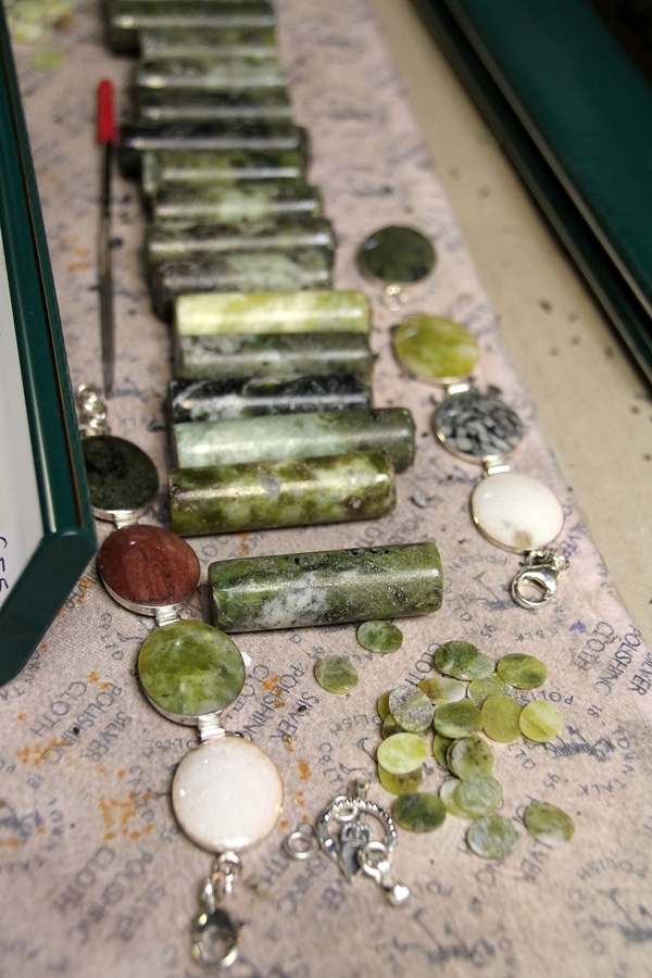 A close up of green marble on a table