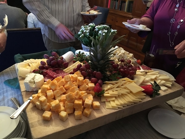 a large cheese and fruit platter