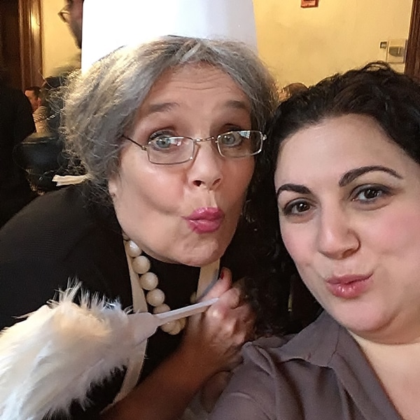 a woman posing with Mrs. White from Clue