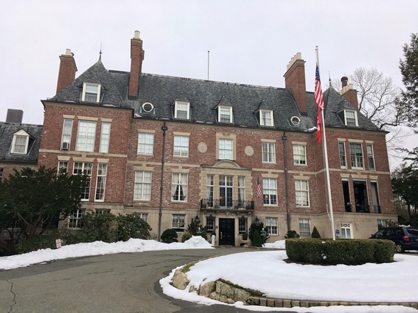 a large brick building with snow in front