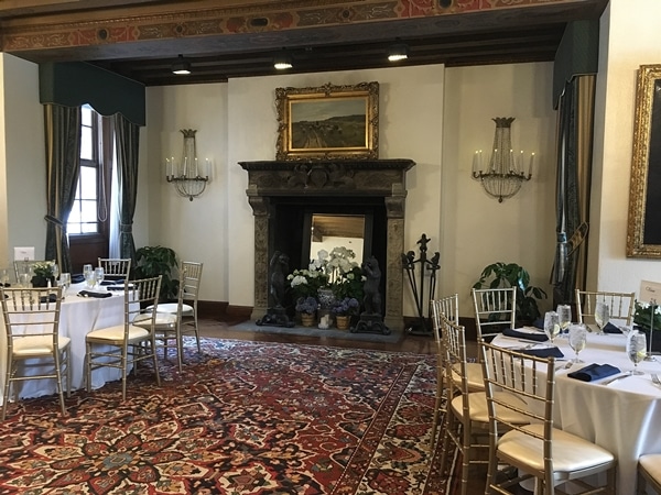 a dining room with a large fireplace