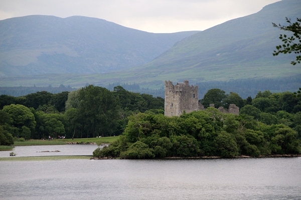 a view of Ross Castle from across the lake