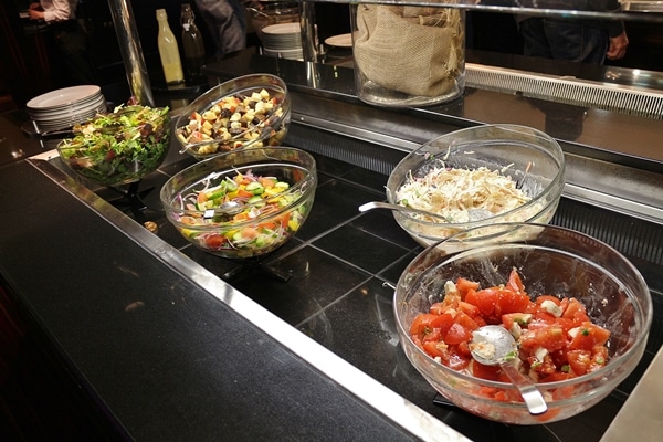 various salads on a buffet line