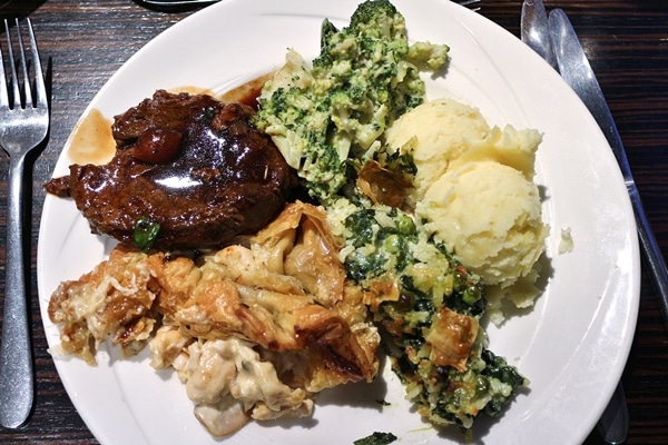 A plate of food from a dinner buffet