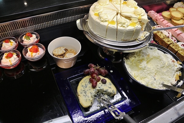 desserts and cheeses on a buffet