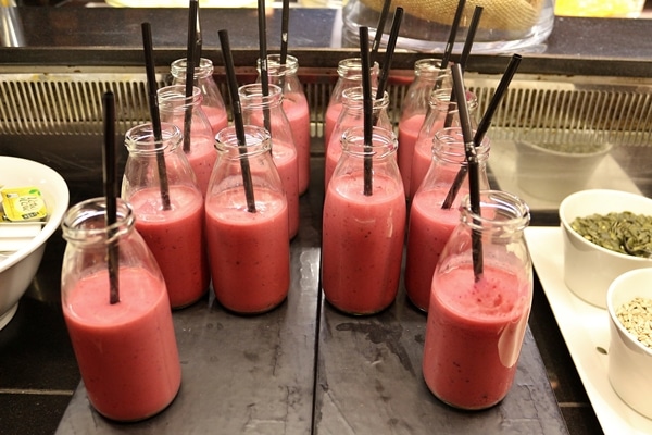 small glass bottles of smoothies